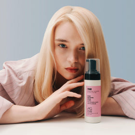 AG Care foam volumizer next to a 5 fl oz marker showing compact travel-friendly benefit