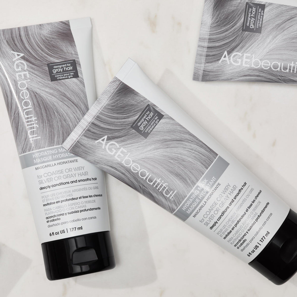 AGE beautiful being applied to mid-lengths and ends for smoother hair