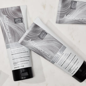 AGE beautiful being applied to mid-lengths and ends for smoother hair