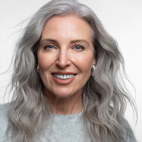 AGE beautiful jar staged on bathroom shelf implying spa-like hydration
