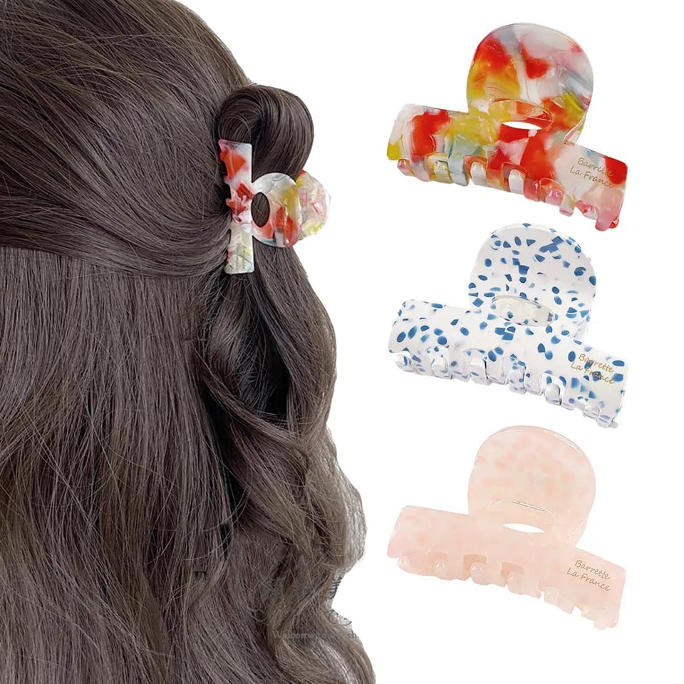 Agirlvct front view of three small claw clips, clear styling benefit