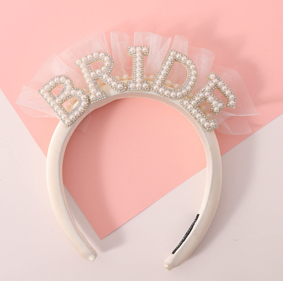 Agkvw front view of headband showing pearl BRIDE detail and veil for instant bridal flair
