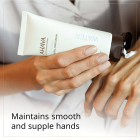AHAVA tube beside Dead Sea minerals underscoring mineral-rich formulation