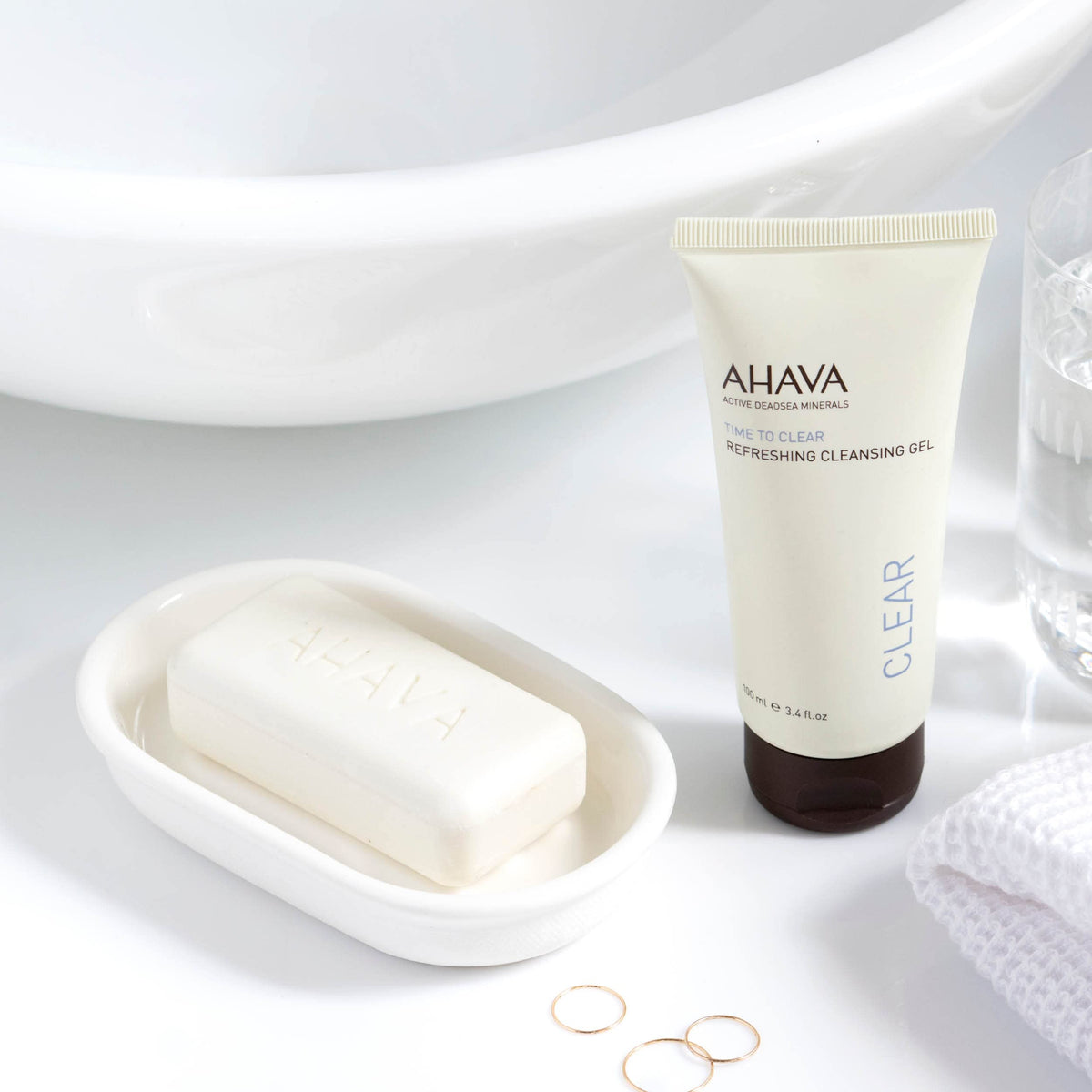 AHAVA pump dispensing cleansing gel into hand for controlled application