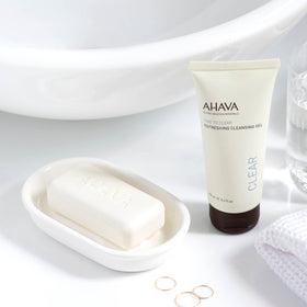 AHAVA pump dispensing cleansing gel into hand for controlled application