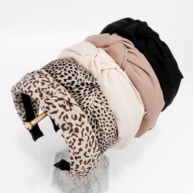 AHONEY leopard-accent headband laid flat showing pattern versatility