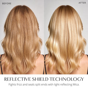 AIIR spraying on styled hair for instant frizz control and gloss