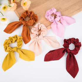 Aileam scrunchies on a vanity table giving fashionable everyday accessory idea