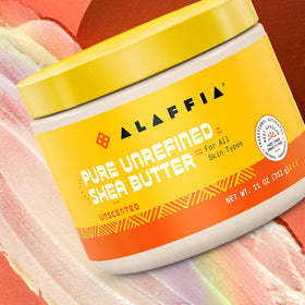 Alaffia shea butter warmed in hands for easy spreadability and hydration