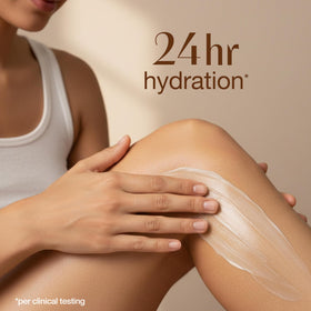 Alba Botanica applying lotion to forearm for instant softening benefit