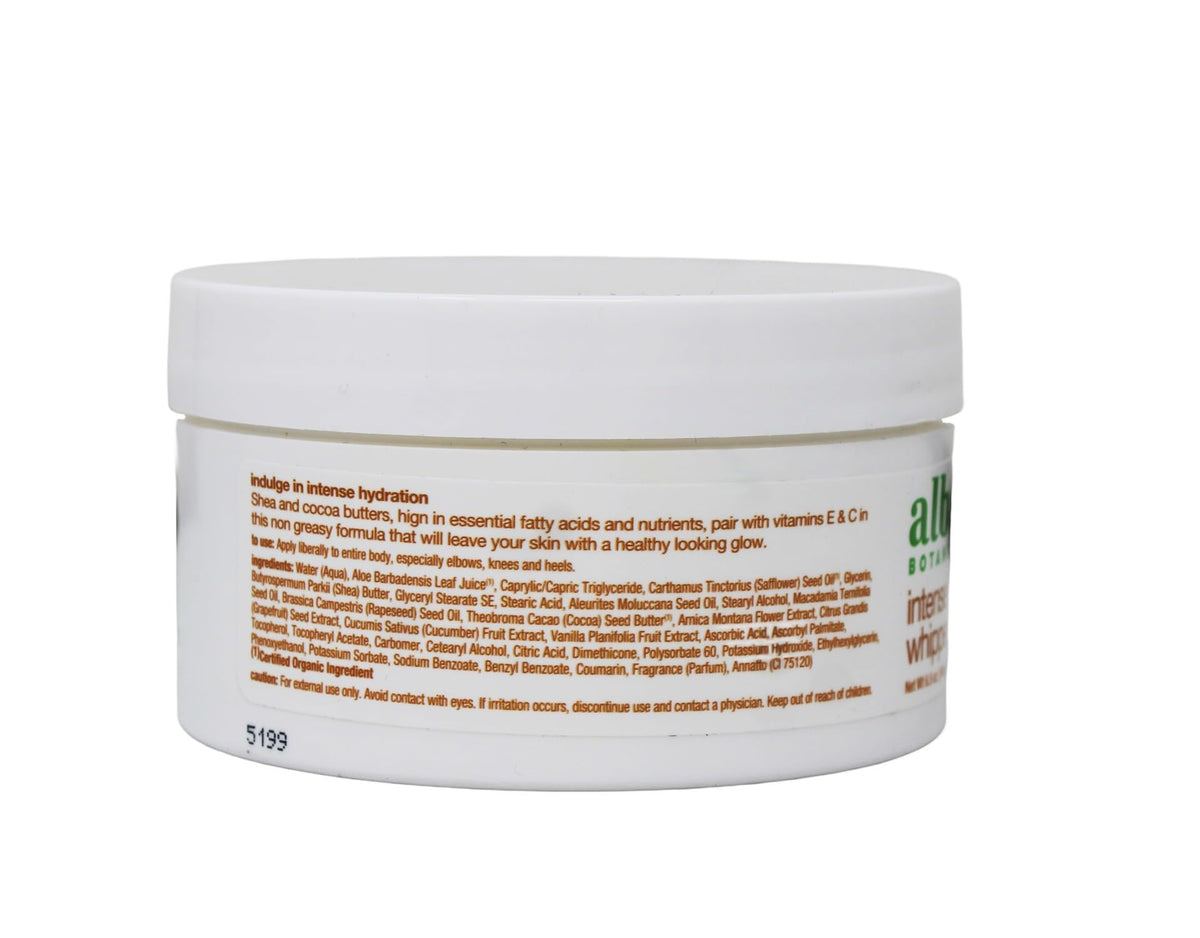 Lifestyle shot of Alba Botanica kukui nut body cream on bathroom shelf suggesting daily moisturizing routine