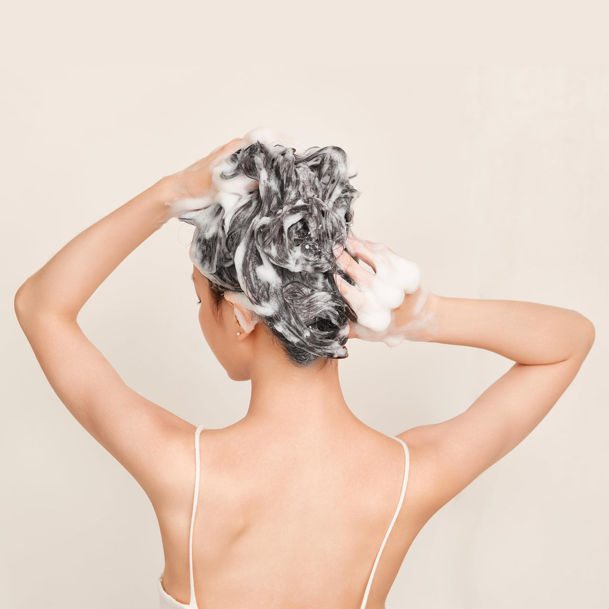 ALFAPARF MILANO shampoo staged in bathroom conveying a luxurious at-home salon experience