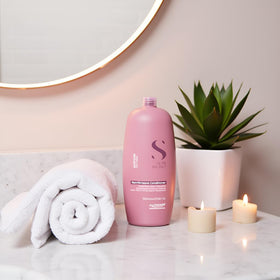Alfaparf Milano on bathroom shelf in lifestyle scene showing daily routine benefit