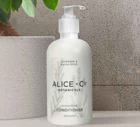 Alice + Co. on bathroom shelf styled to recreate Fairfield by Marriott hotel ambiance
