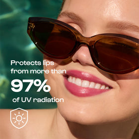 ALLEYOOP lip oil beside sunglasses demonstrating travel-friendly size