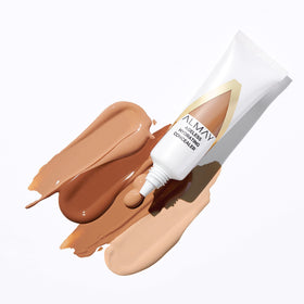 Almay concealer in hand for size and travel-friendly scale