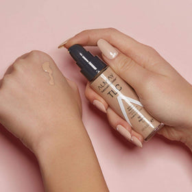 Almay bottle staged with makeup kit showing travel-ready benefit
