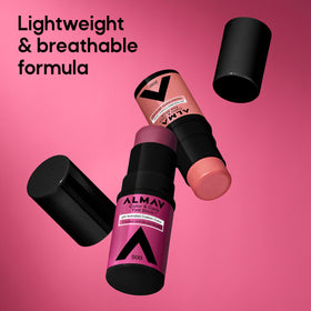 Almay tint stick beside coin to show compact size and portability