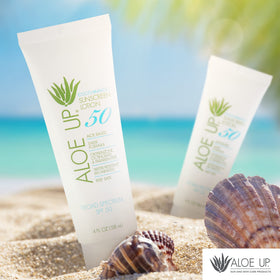 Aloe Up bottle near water showing 80 minute water resistance