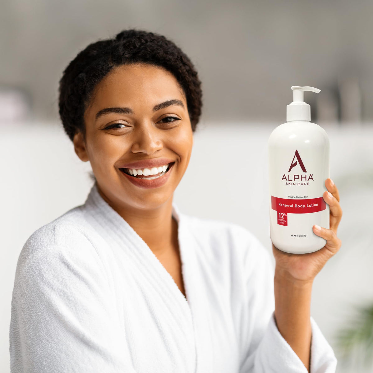 Person applying Alpha lotion on leg for smoother, hydrated skin