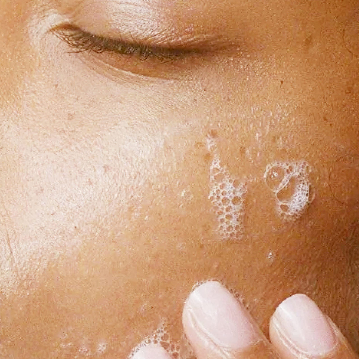 Alpha product in hand during application, illustrating easy dispensing and effective removal
