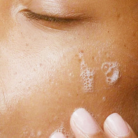 Alpha product in hand during application, illustrating easy dispensing and effective removal
