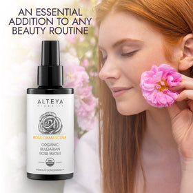Alteya Organics bottle surrounded by fresh rose petals highlighting pure single-ingredient