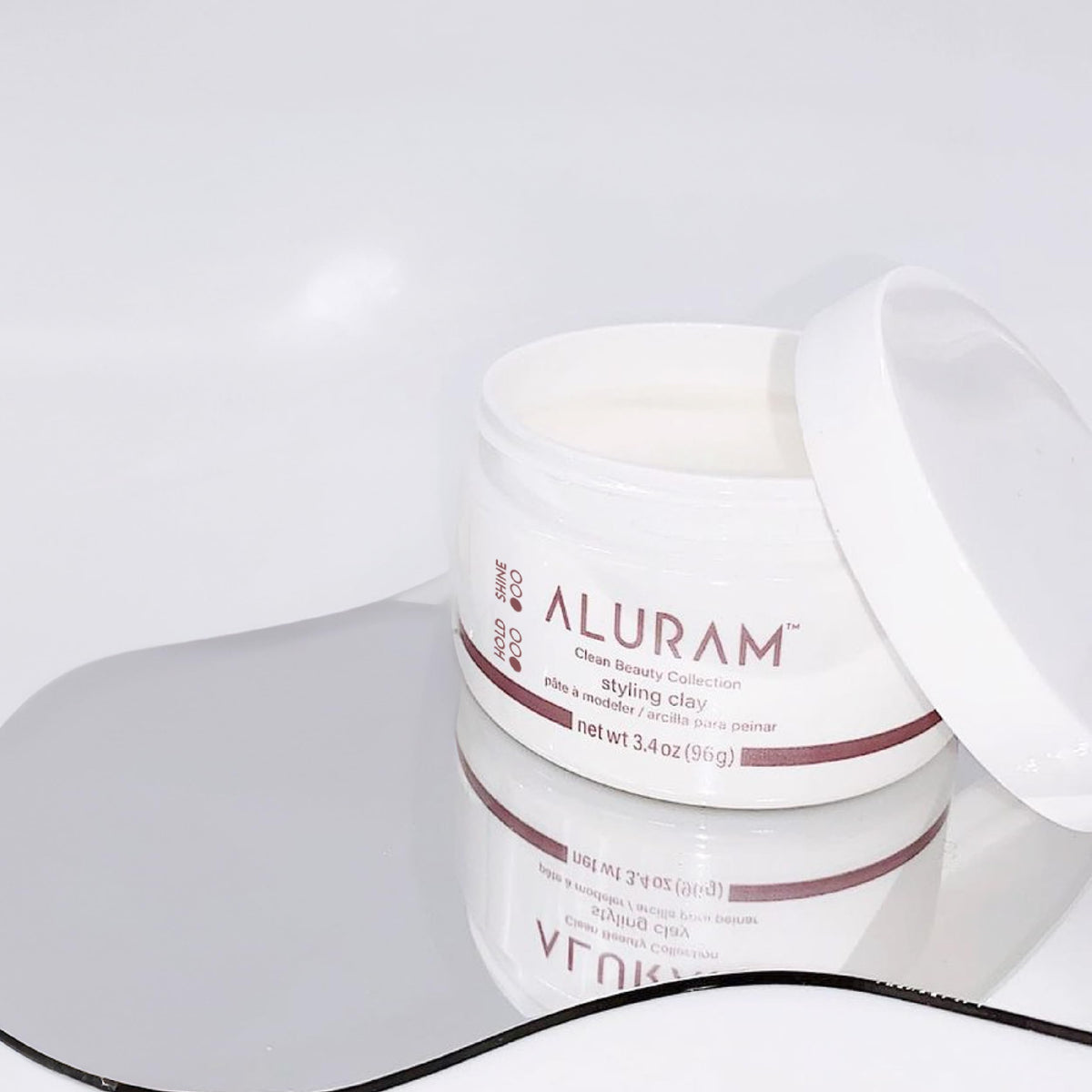 ALURAM texture close-up in hand, reveals smooth clay for easy application