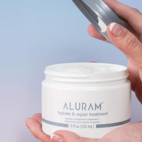 ALURAM open jar revealing purple formula, highlighting pigment and moisturizing finish