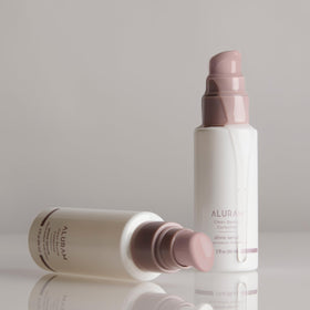 ALURAM clear serum texture drop showing lightweight absorption benefit