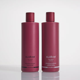 ALURAM creamy conditioner texture on hand showing lightweight moisture and spreadability