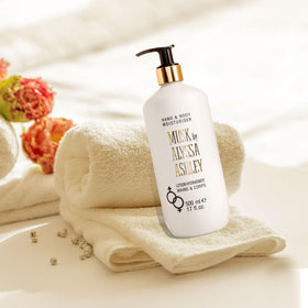 Alyssa Ashley lotion on hand close-up highlighting smooth texture and hydration