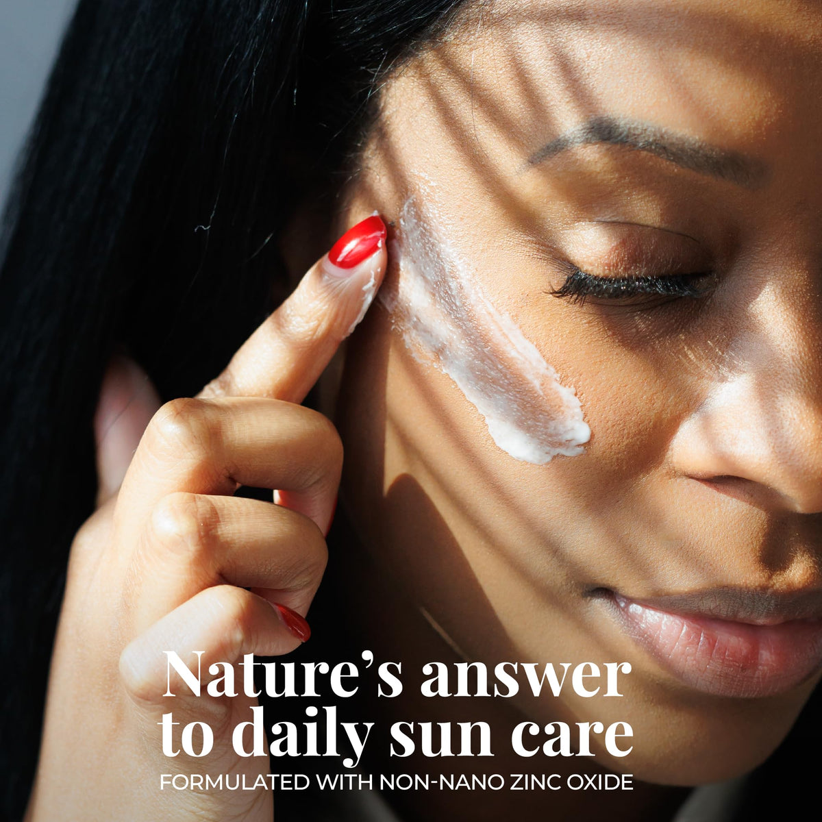 Amallow applying balm on cheek to demonstrate blendable, tinted finish