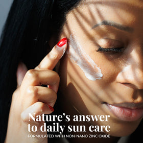 Amallow applying balm on cheek to demonstrate blendable, tinted finish