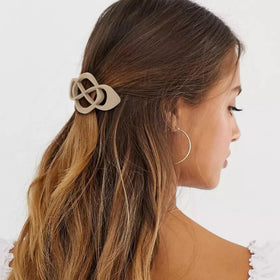 Amariver clip worn in half-up hairstyle demonstrating secure hold and polished look