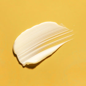 Amazon Basics being applied with fingertip to eye area for gentle hydration