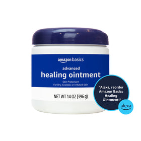 Amazon Basics ointment being applied to a hand with tub nearby demonstrating protective moisturization