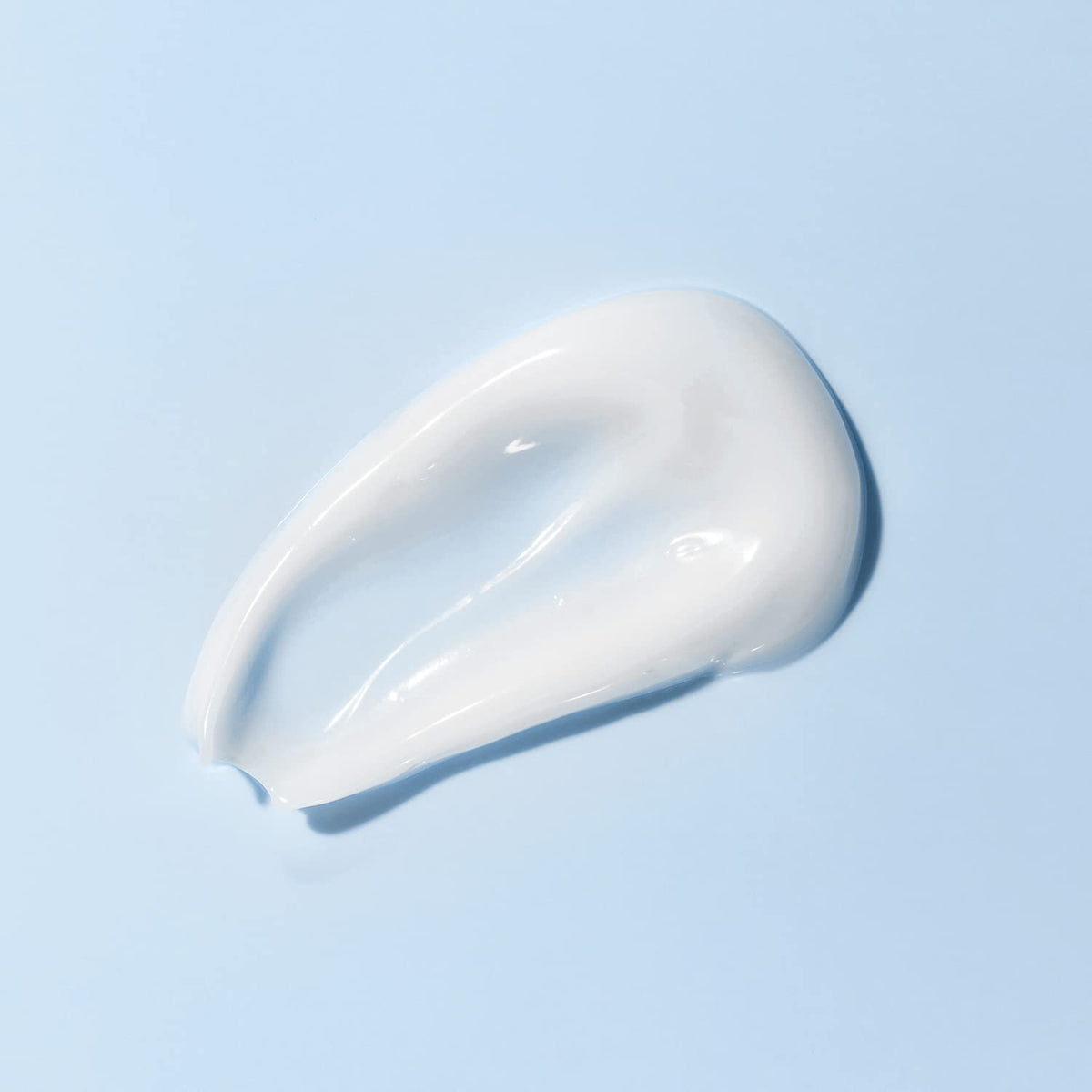 Amazon Basics open jar revealing cream inside, showing generous 16-ounce supply