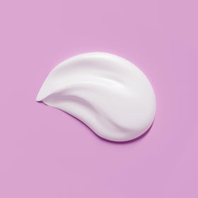 Application on hand with Amazon Basics cream demonstrating lightweight spread and easy patting