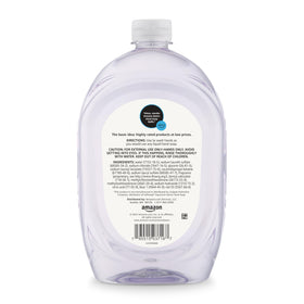 Amazon Basics refill next to a standard pump dispenser demonstrating size and capacity