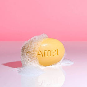 Ambi bar next to moisturizer jar showing complementary hydration routine