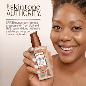 Ambi bottle in hand to show 3.5 fl oz size and portability