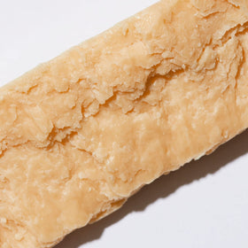 Ambi product label close-up with ingredient and weight details visible