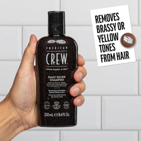 American Crew daily silver shampoo being applied in shower to neutralize brassiness