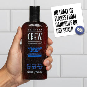 American Crew in use massaging shampoo into scalp to relieve itch