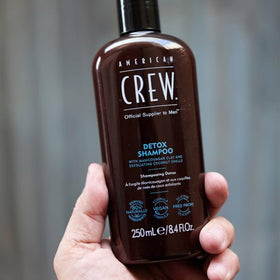 american crew shampoo on shower shelf suggesting daily-ready grooming benefit