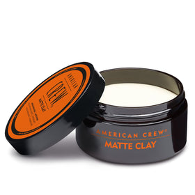 Male model styled with American Crew clay showing natural controlled look
