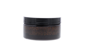 American Crew size comparison next to coin showing compact travel-friendly 3 oz jars
