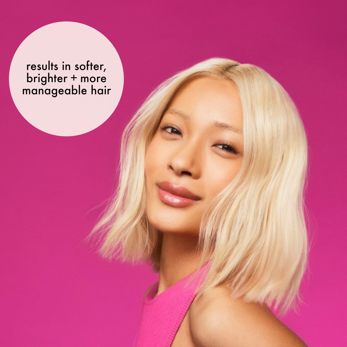 Amika hands applying conditioner to hair to show simple at-home toning and hydration