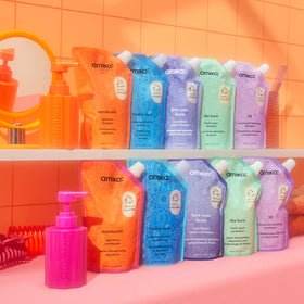 amika forever friend refill pouch pouring into bottle refill action with wide mouth benefit: quick, low‑mess top‑ups